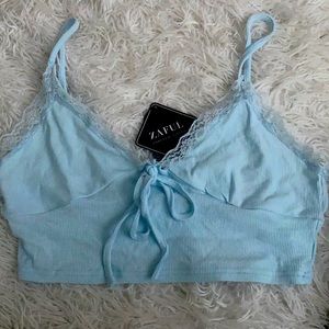 Baby blue tank top, with white lace, stretchy, never worn